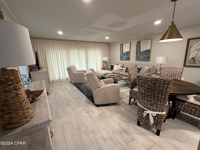 living room with washer / clothes dryer and light hardwood / wood-style floors