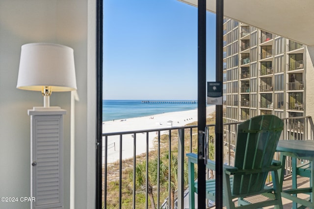 balcony with a view of the beach and a water view