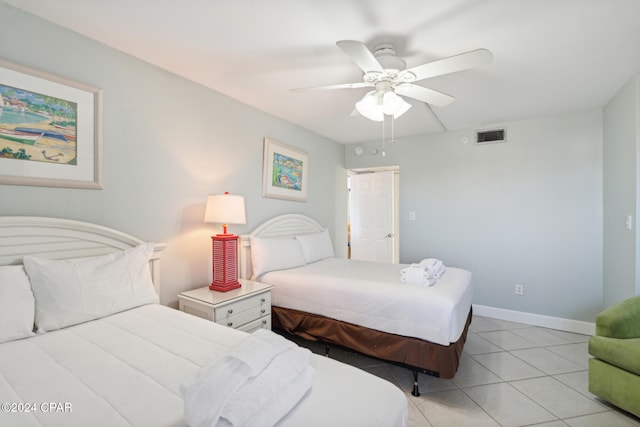 tiled bedroom featuring ceiling fan