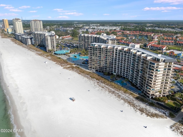 aerial view featuring a water view and a beach view