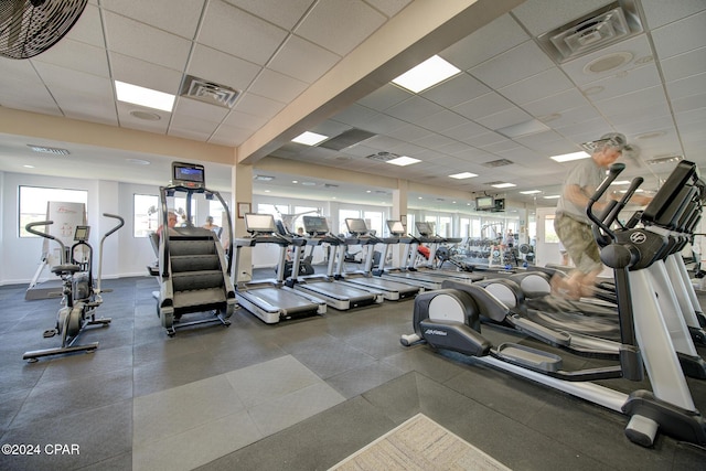 workout area featuring a drop ceiling