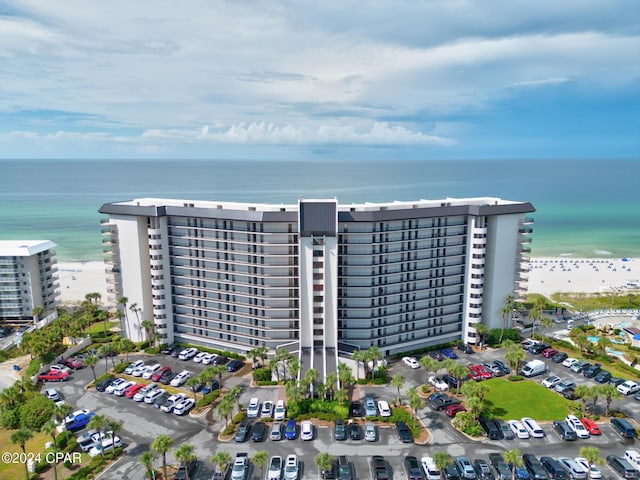 aerial view featuring a water view and a beach view