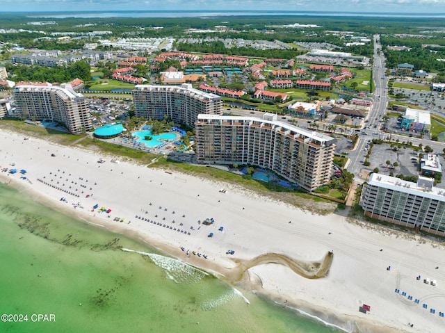 birds eye view of property featuring a view of the beach and a water view