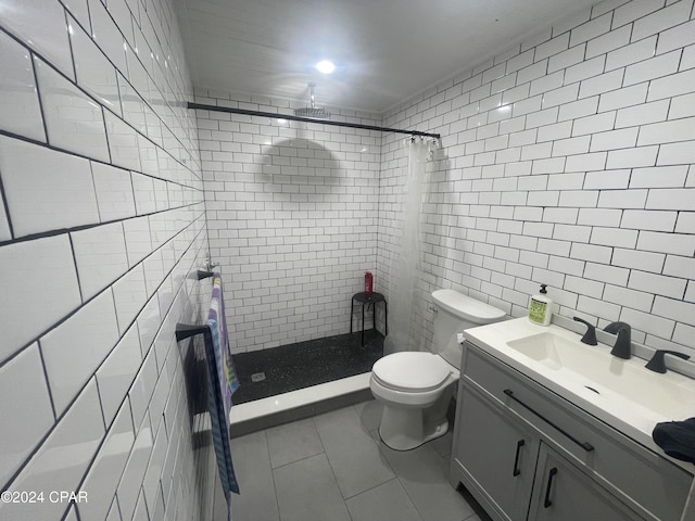 bathroom featuring vanity, curtained shower, toilet, and tile walls