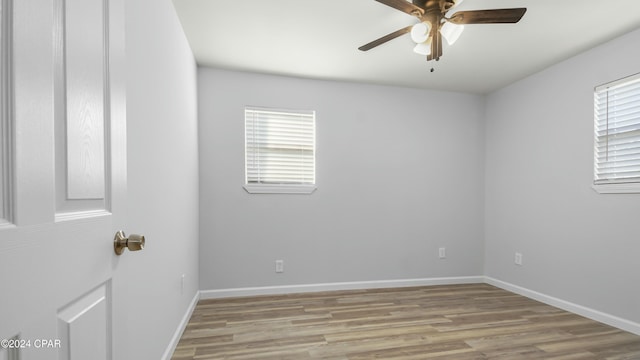 unfurnished room with ceiling fan and light wood-type flooring