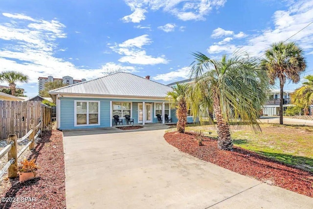 rear view of house with a porch