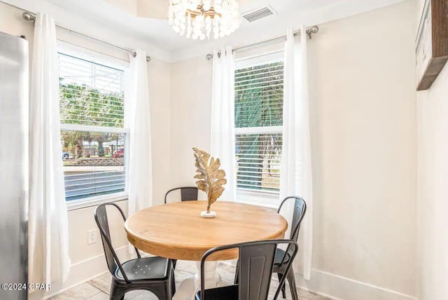 dining space featuring a chandelier