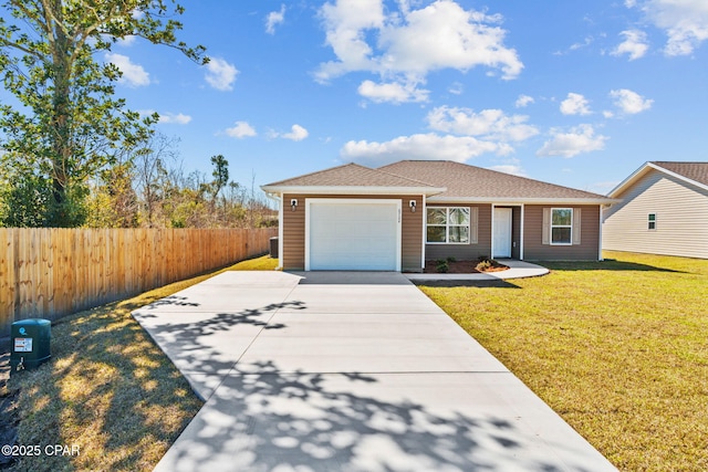 view of front of house featuring a garage, driveway, a front yard, and fence