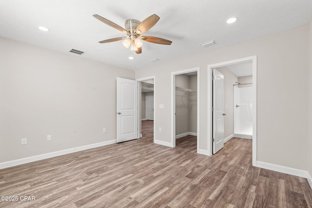 unfurnished bedroom featuring recessed lighting, baseboards, visible vents, and light wood finished floors