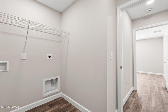 clothes washing area with laundry area, visible vents, wood finished floors, hookup for a washing machine, and hookup for an electric dryer