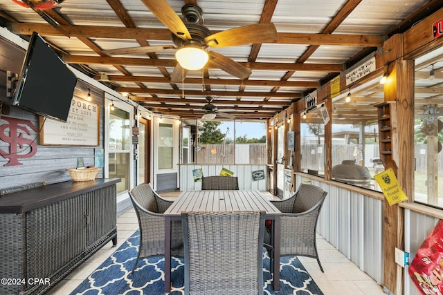 sunroom / solarium with ceiling fan and a wealth of natural light