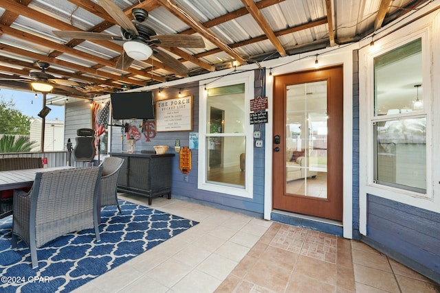 view of patio featuring ceiling fan