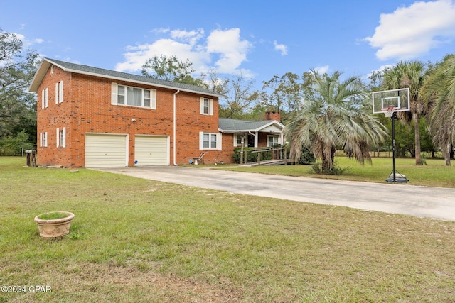 view of front of home featuring a garage and a front lawn