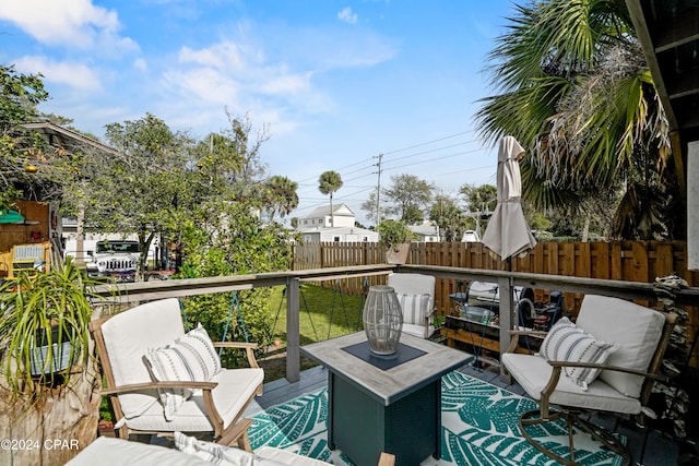 wooden deck with an outdoor hangout area