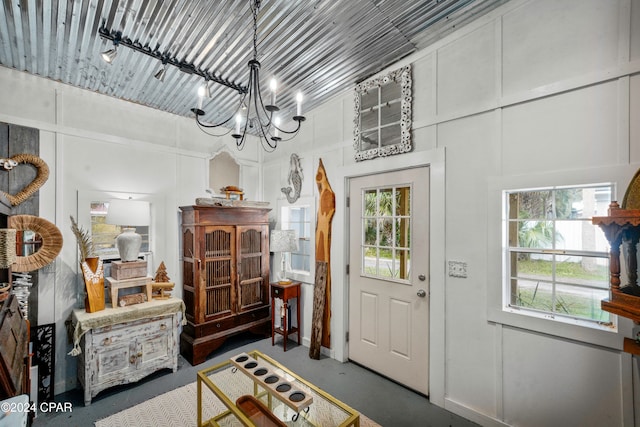 entrance foyer featuring an inviting chandelier