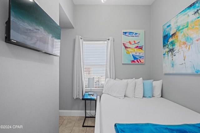 bedroom with light tile patterned flooring