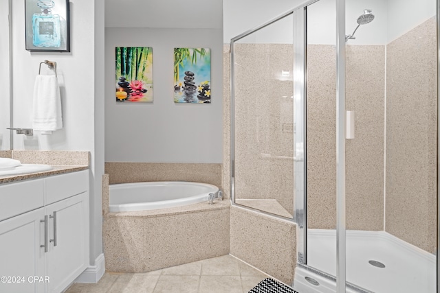 bathroom with tile patterned flooring, vanity, and independent shower and bath