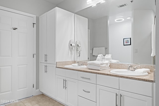 bathroom featuring tile patterned floors and vanity