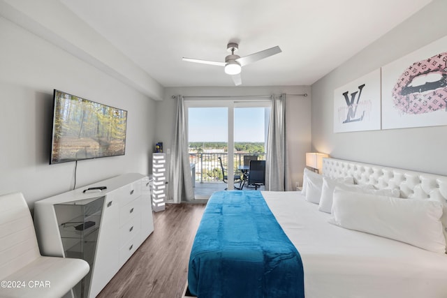 bedroom featuring access to exterior, dark hardwood / wood-style floors, and ceiling fan