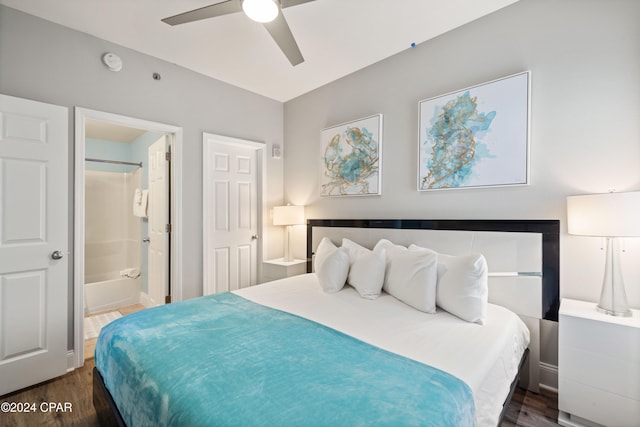 bedroom with dark hardwood / wood-style floors, ceiling fan, and ensuite bath