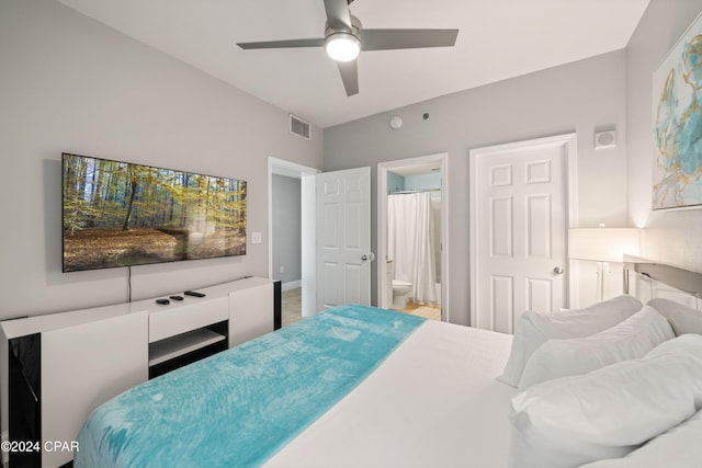 bedroom with ensuite bath and ceiling fan