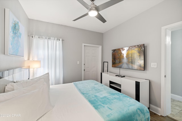 bedroom featuring hardwood / wood-style floors and ceiling fan