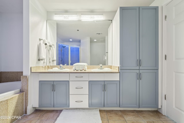 bathroom with separate shower and tub, tile patterned flooring, and vanity