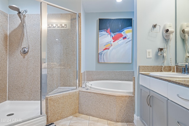 bathroom featuring tile patterned floors, vanity, and separate shower and tub