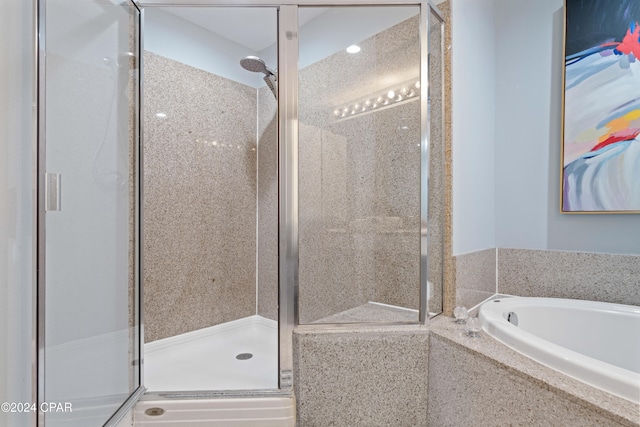 bathroom featuring plus walk in shower