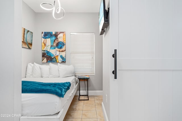 bedroom featuring light tile patterned floors