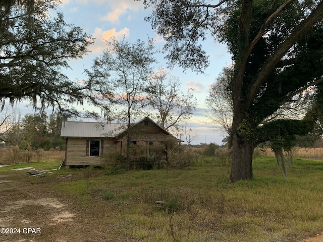 view of property exterior at dusk