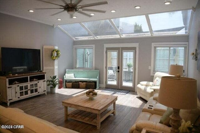 living room with ceiling fan, french doors, wood-type flooring, and vaulted ceiling