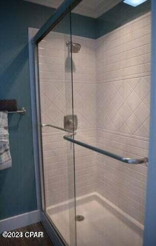 bathroom with a shower with shower door