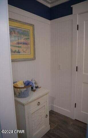 bathroom with wood walls