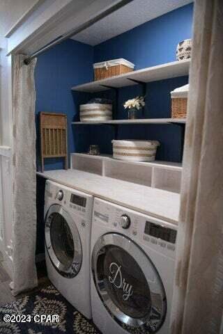 washroom featuring washer and dryer