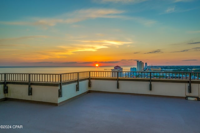 patio terrace at dusk with a water view