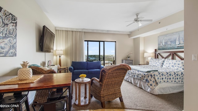 carpeted bedroom featuring access to exterior and ceiling fan