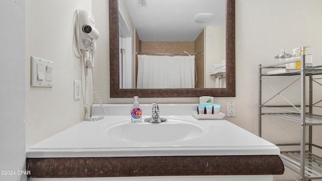 bathroom featuring vanity and walk in shower