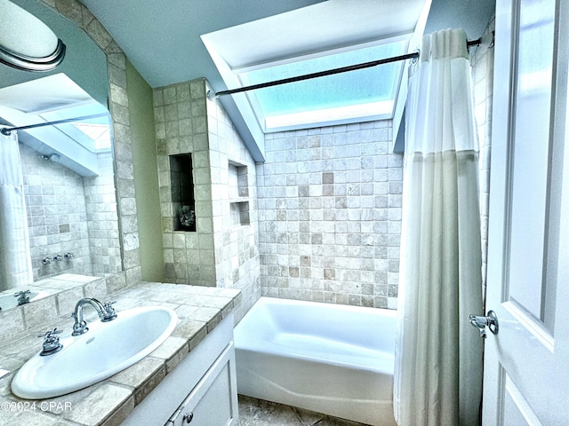 bathroom featuring vanity and shower / bath combination with curtain