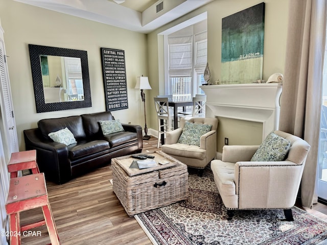 sitting room featuring wood-type flooring