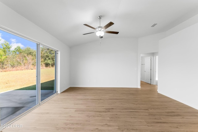 spare room with ceiling fan and dark carpet