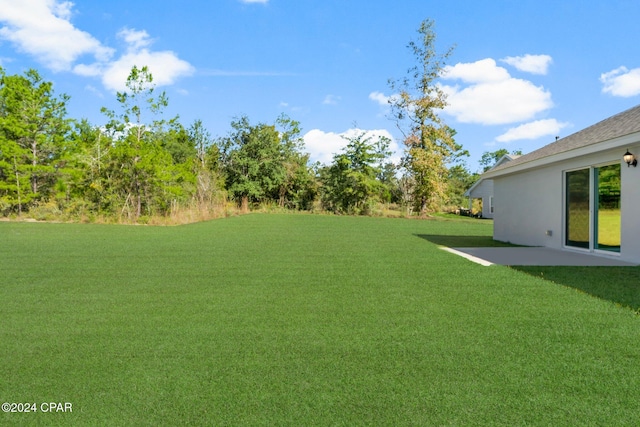 rear view of property with a lawn and central AC