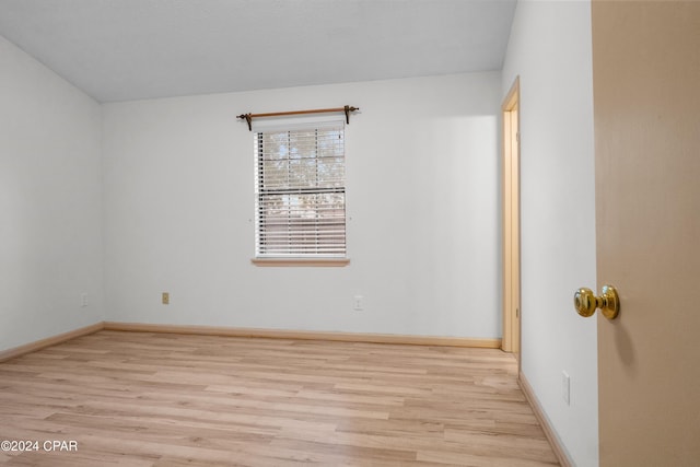 empty room with light hardwood / wood-style floors