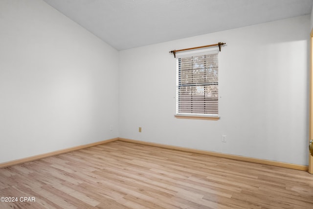 spare room featuring light hardwood / wood-style flooring