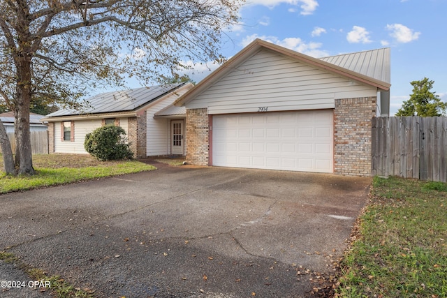 single story home featuring a garage