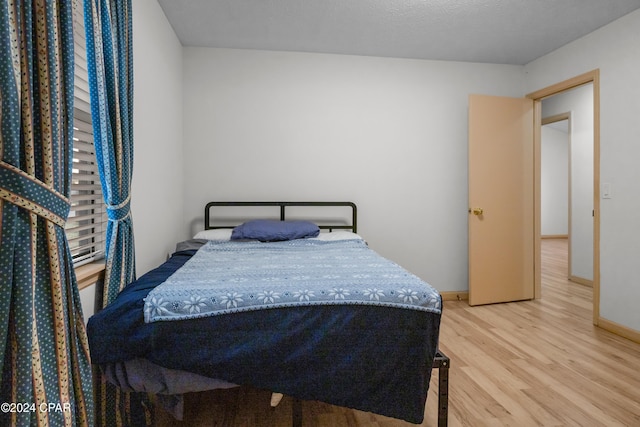 bedroom featuring wood-type flooring