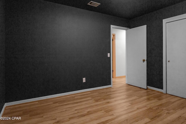 unfurnished bedroom with light hardwood / wood-style floors