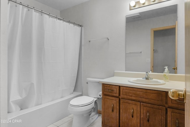 full bathroom featuring tile patterned flooring, vanity, shower / tub combo, and toilet