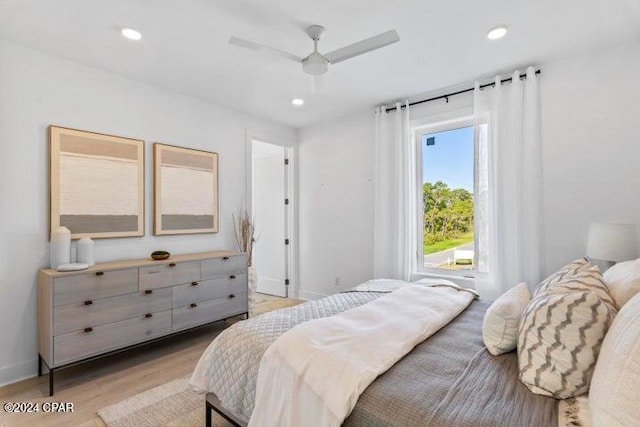 bedroom featuring light hardwood / wood-style flooring and ceiling fan