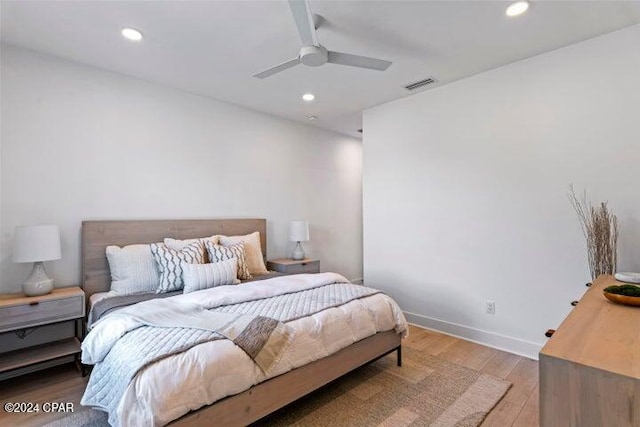 bedroom featuring hardwood / wood-style flooring and ceiling fan